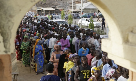 People queue to vote in the town of Yola in eastern Nigeria.