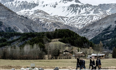 People arrive to pay tribute to the victims of a Germanwings flight that crashed in the French Alps.