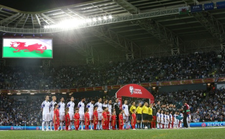 The teams line up before the match.