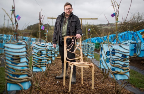 Gavin Munro, founder of Full Grown in Derbyshire, with a chair and moulds used to grow lampshades.