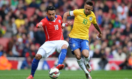 Gonzalo Jara of Chile and Neymar of Brazil compete for the ball.