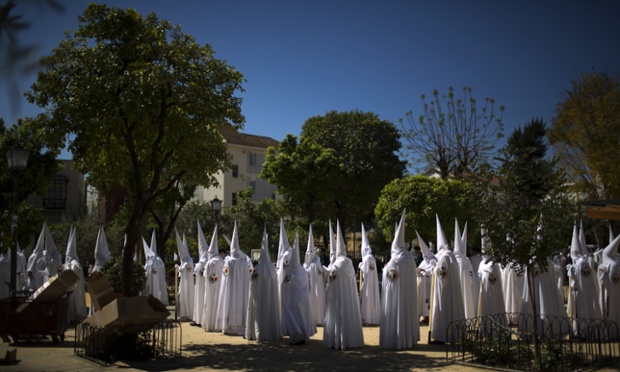 Penitents from the La Paz brotherhood prepare to take part in a procession in Seville. Hundreds of processions take place throughout Spain during the Easter Holy Week