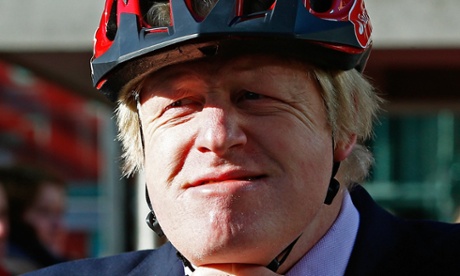 Boris Johnson closes the strap on his helmet after announcing Santander as the new sponsor for the London Cycle Hire