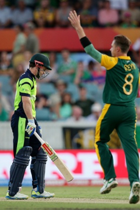 Dale Steyn celebrates after taking the wicket of Ireland's Ed Joyce.