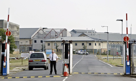 A security guard at gates to Yarl's Wood