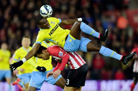 Yannick Bolasie of Crystal Palace and Maya Yoshida of Southampton compete for the ball.