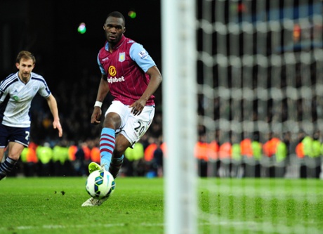 Christian Benteke slots home the winning penalty as cool as you like.