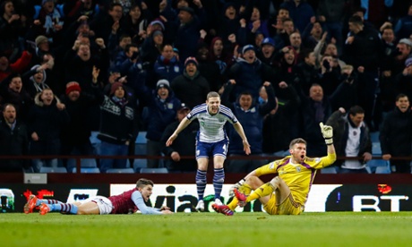 Then attempts to claim he got the ball whilst the Villa fans celebrate.