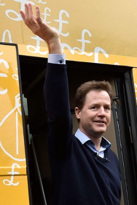 Britain's Deputy Prime Minister and Liberal Democrats leader, Nick Clegg, stands in the doorway of the campaign bus during the party's general election campaign launch in Abingdon, southern England March 29, 2015. Britain will go to the polls in a national election on May 7.