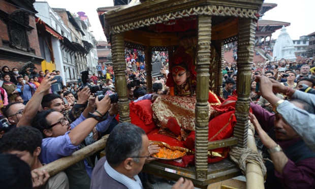 Nepal's Living Goddess the Kumari Devi is carried by worshippers