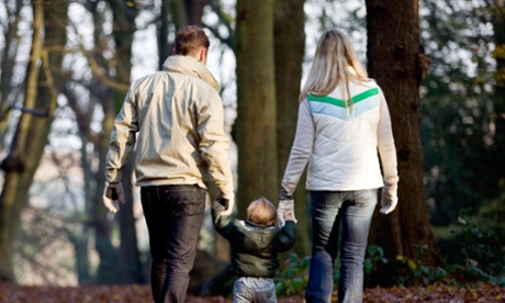 Parents walking with child