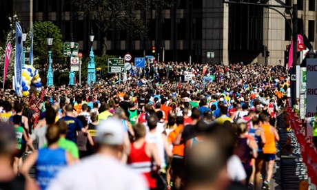 Runners make their way over Tower Bridge during the Virgin Money London Marathon on April 13, 2014