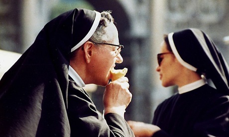 Ice cream for the nun Several nuns were feeling overheated outside the Coliseum in Rome, this one was cooling down - such an indulgence!
