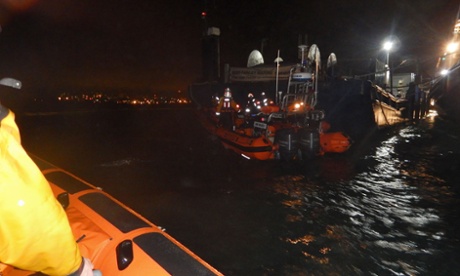 RNLI lifeboats on the scene at the Esso refinery marine terminal at Fawley, after a man jumped into the water to help rescue a crew member from a tugboat.