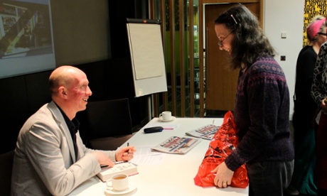 Piers Torday signs books at the conference