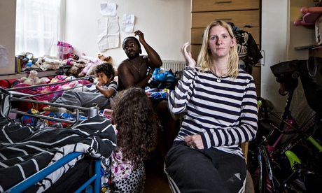 Victims of the housing crisis … Stacey Thomas with her family in their one-room-home at England's La