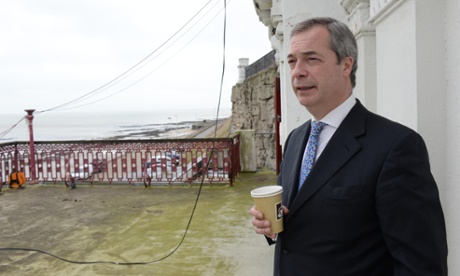 Nigel Farage, paper coffee cup in hand, looks out to sea in Margate, Kent.