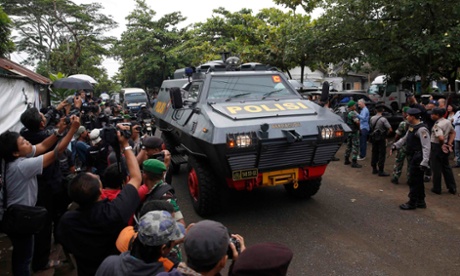 The armoured police vehicle believed to be carrying the two Australians arrives at the ferry port.