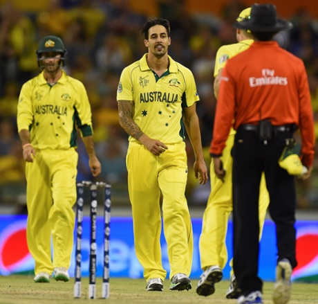 Mitchell Johnson celebrates taking the wicket of Afghanistan's Usman Ghani.