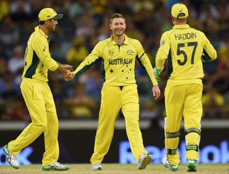 Michael Clarke celebrates with teammates after taking the wicket of Samiullah Shenwari.
