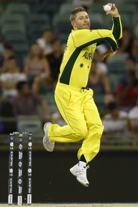 Michael Clarke bowls.