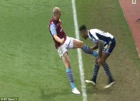 Alan Hutton makes a high tackle on Saido Berahino.