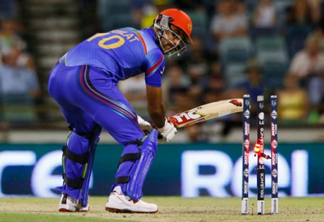 Dawlat Zadran watches as he is bowled by Mitchell Starc