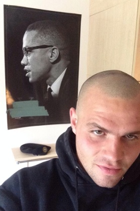 Scurfield with a poster of Malcolm X