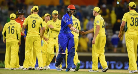 Shahpur Zadran shakes hands with Australian team members as he leaves the ground at the conclusion.