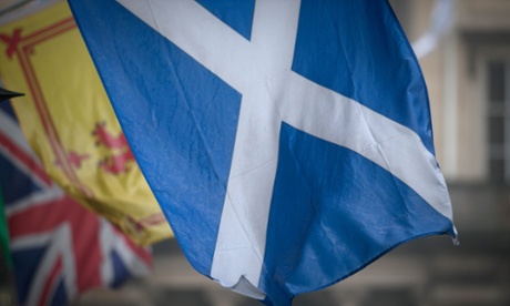 Scottish Saltire with the Welsh and Union flags in the background