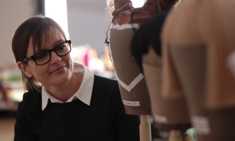 Netia Jones with wigs (for the Cheshire Cat, Bill the Lizard, and Alice) from her production Alice In Wonderland.