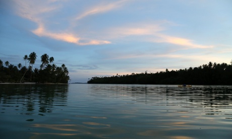 Kayaking at sunset among the islands off the east coast of Papua New Guinea.