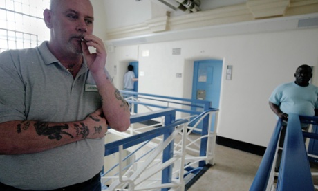 An inmate smokes on a landing in Wandsworth prison