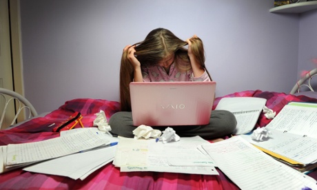 Stressed student revising for an exam