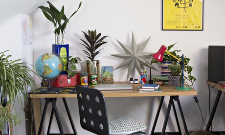 Becky Barnicoat's desk after a plant makeover, complete with old tins as pots.