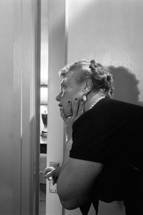 Woman peeking through door