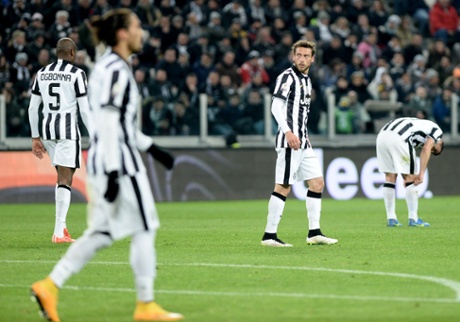 Juventus' players dejected after that second goal.