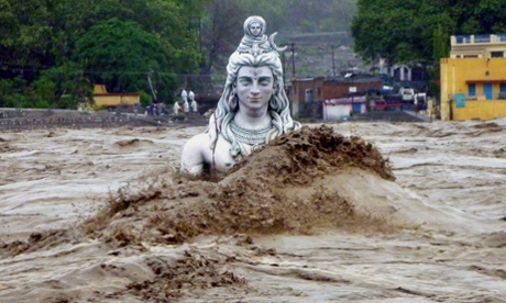 A submerged idol of Hindu Lord Shiva stands in the flooded river Ganges at Rishikesh on June 18, 2013.