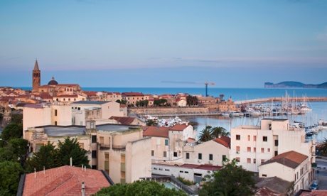 View of Alghero at dusk, Sassari Province, Sardinia, Italy