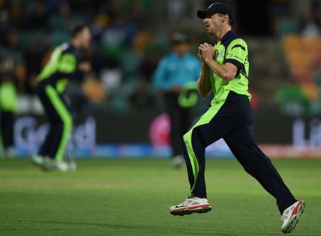 Ireland's Alex Cusack takes a catch to dismiss Zimbabwe batsman Solomon Mire.