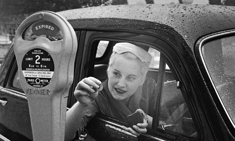 Parking at a coin-operated parking meter in the 1950s.