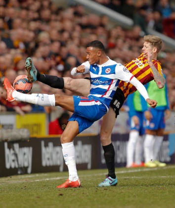 Some high kicking from Reading's Jordan Obita and Bradford City's Jonathan Stead.