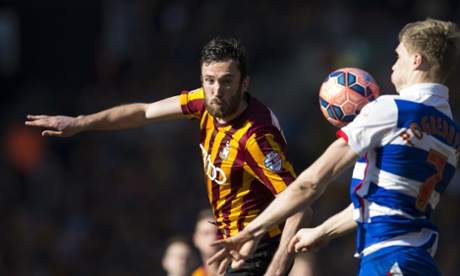 Bradford's Rory McArdle looks on as Reading's Pavel Pogrebnyak brings the ball down on his chest.