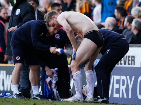 Pearce is washed down after his bloody nose injury.