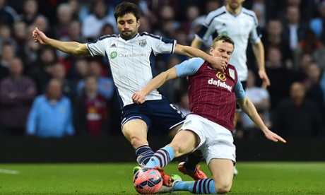 There's a midfield tussle going on between Aston Villa's Tom Cleverley, right, and West Bromwich Albion's Claudio Yacob.