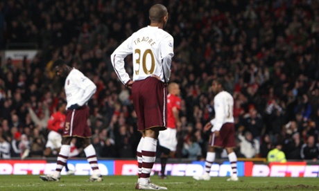 Arsenal's Armand Traoré looks on dejectedly after Manchester United score in the 4-0 win at Old Trafford in 2008.