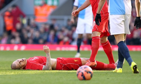 Martin Skrtel is injured after colliding with Rudy Gestede as they battled for the ball.