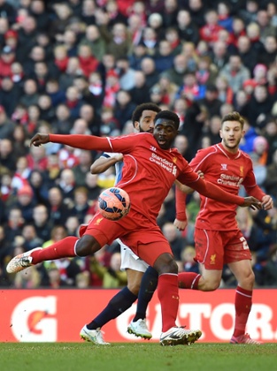 Kolo Toure has a shot on goal.