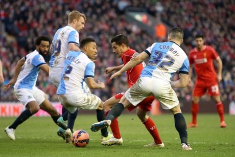 Philippe Coutinho takes on Blackburn Rovers' Craig Conway and Adam Henley.