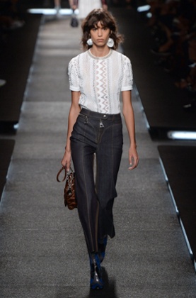 A model wears jeans with an exposed zip at Louis Vuitton's spring/summer 2015 show.